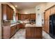 Well-equipped kitchen features custom cabinets, granite countertops, a center island, and stainless appliances at 1922 E Everett Dr, Phoenix, AZ 85022