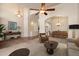 Inviting living room featuring an open-concept design, tile flooring, and abundant natural light at 1922 E Everett Dr, Phoenix, AZ 85022