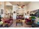 Cozy living room featuring comfortable seating, a ceiling fan, and decorative artwork at 1922 E Everett Dr, Phoenix, AZ 85022