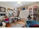 Bright and creative home office space with an abundance of art, windows, and natural light at 1922 E Everett Dr, Phoenix, AZ 85022