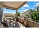Relaxing covered patio seating area overlooking desert landscape, blue skies, and distant mountain at 1922 E Everett Dr, Phoenix, AZ 85022