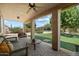 Outdoor living space with lush landscaping, a built-in BBQ, and seating area at 1922 E Everett Dr, Phoenix, AZ 85022