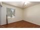 Light filled bedroom with wood flooring, neutral walls, and a bright window at 19251 N 17Th Dr, Phoenix, AZ 85027