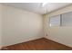 Cozy bedroom with warm wood floors and a window offering natural light at 19251 N 17Th Dr, Phoenix, AZ 85027