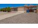 A charming single-Gathering home boasting a well-maintained front yard, shade trees, and covered carport at 19251 N 17Th Dr, Phoenix, AZ 85027