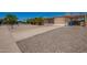 A charming single-Gathering home boasting a well-maintained front yard, shade trees, and covered carport at 19251 N 17Th Dr, Phoenix, AZ 85027