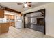 Cozy kitchen adjacent to the living room with tiled floors and ample light at 19251 N 17Th Dr, Phoenix, AZ 85027