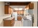 Kitchen with light wood cabinets and stainless appliances at 19251 N 17Th Dr, Phoenix, AZ 85027
