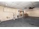Open living room with ceiling fan, and an opening to the kitchen at 19251 N 17Th Dr, Phoenix, AZ 85027