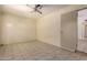 Neutral living room featuring tile floors, and a utility door at 19251 N 17Th Dr, Phoenix, AZ 85027