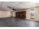 Large living room showcasing a brick fireplace and access to the backyard at 19251 N 17Th Dr, Phoenix, AZ 85027