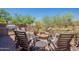 Cozy backyard patio with a built-in grill and fire pit, perfect for outdoor entertaining at 19475 N Grayhawk Dr # 1039, Scottsdale, AZ 85255