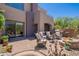 Inviting backyard with a built-in grill, fire pit, and comfortable seating for outdoor enjoyment at 19475 N Grayhawk Dr # 1039, Scottsdale, AZ 85255