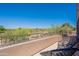 Relaxing balcony space with chairs, offering panoramic views of the surrounding green landscape at 19475 N Grayhawk Dr # 1039, Scottsdale, AZ 85255