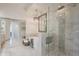 Luxurious bathroom featuring a freestanding tub, glass-enclosed shower, and elegant marble finishes at 19475 N Grayhawk Dr # 1039, Scottsdale, AZ 85255