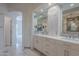 Spacious bathroom featuring dual vanities, ample storage, and modern fixtures for convenience and style at 19475 N Grayhawk Dr # 1039, Scottsdale, AZ 85255