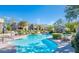 Beautiful community pool area with lounge chairs, cabana, and lush landscaping for relaxation at 19475 N Grayhawk Dr # 1039, Scottsdale, AZ 85255