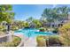 Resort-style community pool with lush landscaping, comfortable seating, and a shaded cabana at 19475 N Grayhawk Dr # 1039, Scottsdale, AZ 85255