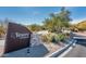 Elegant community entrance featuring a sign, stone accents, and lush desert landscaping at 19475 N Grayhawk Dr # 1039, Scottsdale, AZ 85255