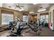 Well-equipped exercise room featuring treadmills, weights, and other fitness machines for resident use at 19475 N Grayhawk Dr # 1039, Scottsdale, AZ 85255
