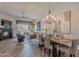 Open living and dining areas with fireplace, hardwood floors, and desert views at 19475 N Grayhawk Dr # 1039, Scottsdale, AZ 85255