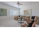Spacious living room featuring a comfortable sectional sofa, a coffee table, and neutral decor at 19475 N Grayhawk Dr # 1039, Scottsdale, AZ 85255