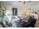 Airy living room featuring modern decor, elegant furnishings, and an open floor plan connected to the dining area at 19475 N Grayhawk Dr # 1039, Scottsdale, AZ 85255