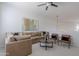 Comfortable living room featuring a large sectional sofa, stylish chairs, and neutral decor at 19475 N Grayhawk Dr # 1039, Scottsdale, AZ 85255