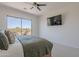 Serene main bedroom featuring balcony access and wall-mounted TV for ultimate relaxation at 19475 N Grayhawk Dr # 1039, Scottsdale, AZ 85255