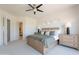 Well-appointed main bedroom boasts balcony access, a neutral palette, and connecting bathroom at 19475 N Grayhawk Dr # 1039, Scottsdale, AZ 85255