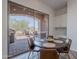 Breakfast Nook looking onto covered outdoor patio with built-in kitchen, BBQ, and desert landscaping at 19475 N Grayhawk Dr # 1039, Scottsdale, AZ 85255
