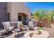 Relaxing patio with comfortable seating, built-in grill, and cozy fire pit for outdoor entertainment at 19475 N Grayhawk Dr # 1039, Scottsdale, AZ 85255