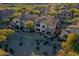 Gorgeous aerial view of desert community townhomes with lush desert landscaping around the buildings at 19475 N Grayhawk Dr # 1115, Scottsdale, AZ 85255