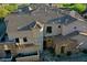 Stunning aerial view showcasing the roofline, stone accents, and landscaping at 19475 N Grayhawk Dr # 1115, Scottsdale, AZ 85255