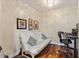 Cozy bedroom with hardwood floors, neutral walls, and a white futon at 19475 N Grayhawk Dr # 1115, Scottsdale, AZ 85255