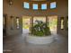 Stunning entrance to the clubhouse, featuring columns and an array of desert plants at 19475 N Grayhawk Dr # 1115, Scottsdale, AZ 85255