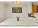 Bright dining room with a view of the kitchen area at 19475 N Grayhawk Dr # 1115, Scottsdale, AZ 85255
