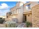 Charming stucco home with stone accents and manicured landscaping at 19475 N Grayhawk Dr # 1115, Scottsdale, AZ 85255