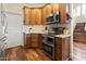 Well-equipped kitchen with stainless steel appliances and granite countertops at 19475 N Grayhawk Dr # 1115, Scottsdale, AZ 85255