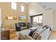 Bright living room with fireplace, vaulted ceilings, and clerestory windows at 19475 N Grayhawk Dr # 1115, Scottsdale, AZ 85255