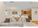 Open-concept living room and kitchen area with a neutral color palette at 19475 N Grayhawk Dr # 1115, Scottsdale, AZ 85255