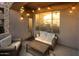 Inviting patio with comfortable seating and ambient string lights at 19475 N Grayhawk Dr # 1115, Scottsdale, AZ 85255