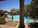 Inviting community pool with clear blue water, lounge chairs and outdoor lounging areas at 19475 N Grayhawk Dr # 1115, Scottsdale, AZ 85255