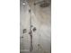 Modern shower featuring elegant marble-look tiling and upscale fixtures at 19475 N Grayhawk Dr # 1115, Scottsdale, AZ 85255