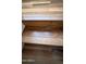 Hardwood stairs featuring a natural wood grain finish at 19475 N Grayhawk Dr # 1115, Scottsdale, AZ 85255