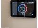 Smart home thermostat display showing current temperature and settings at 19475 N Grayhawk Dr # 1115, Scottsdale, AZ 85255