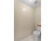 Powder room with toilet, TP holder and clean, bright interior at 19475 N Grayhawk Dr # 1115, Scottsdale, AZ 85255