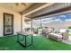 Covered patio with outdoor furniture, turf, and a view of the backyard pool at 2052 E Scorpio Pl, Chandler, AZ 85249