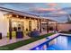 Backyard featuring a pool and patio with ceiling fan and patio lighting at 2052 E Scorpio Pl, Chandler, AZ 85249
