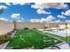 Spacious backyard with lush lawn, flower beds, basketball hoop and inviting pool at 2052 E Scorpio Pl, Chandler, AZ 85249